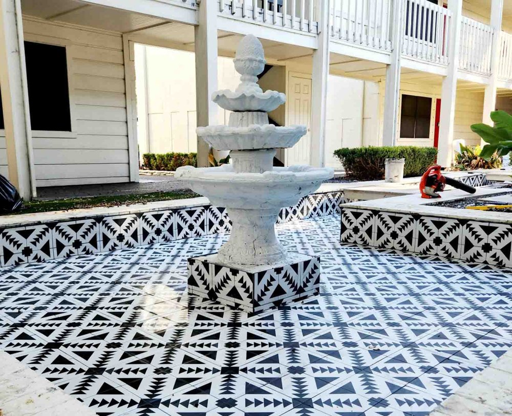 Tiered fountain on a patterned tile plaza